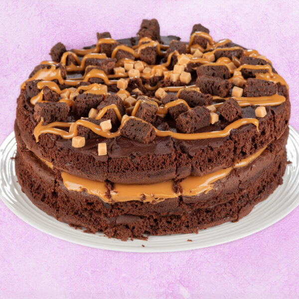 Double layer chocolate fudge cake with caramel drizzle and brownie chunks